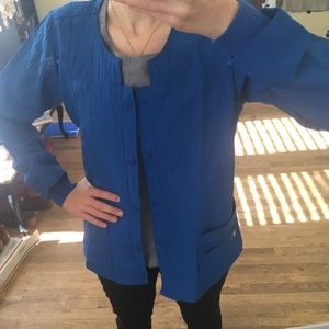 Button Front Solid Scrub Jacket by WonderWink